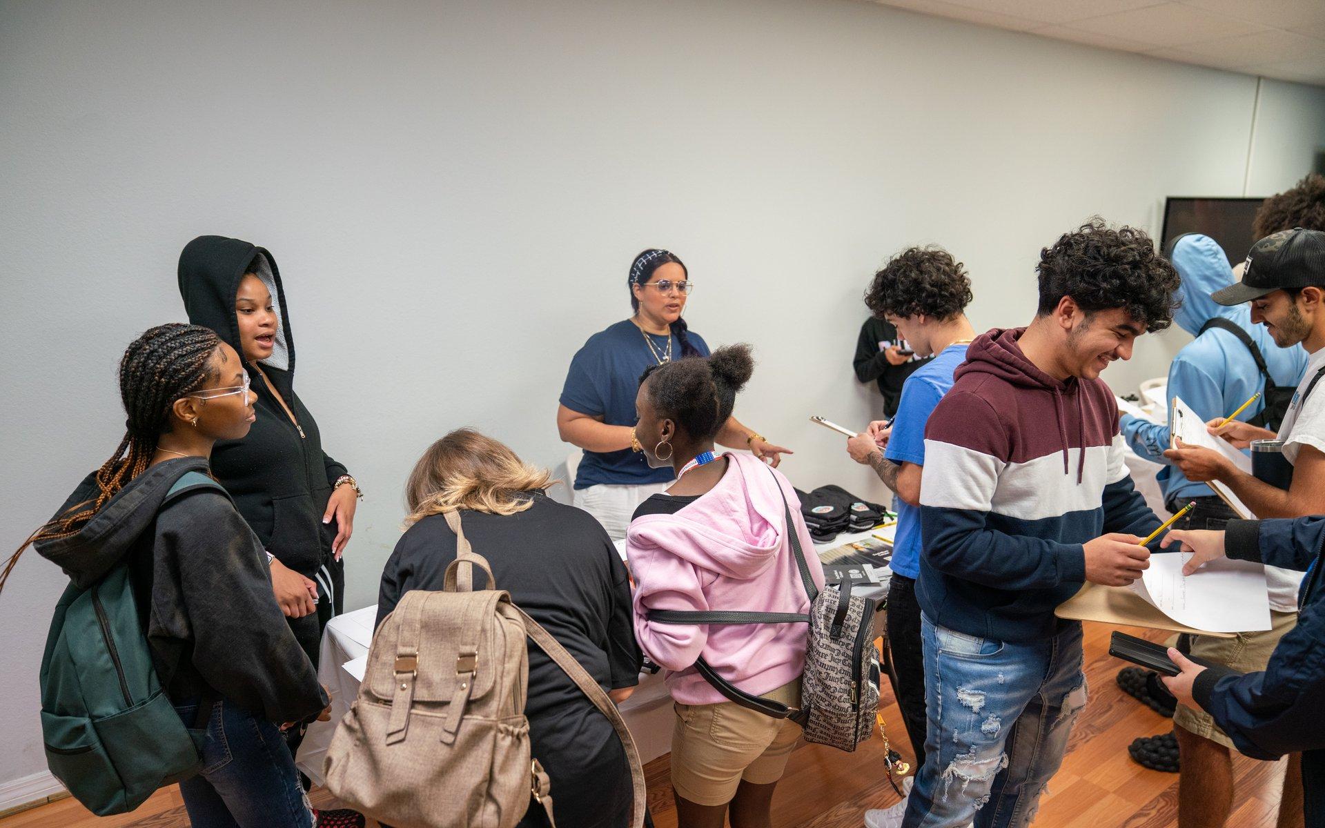 North Dade Academy students visiting tables at a career fair